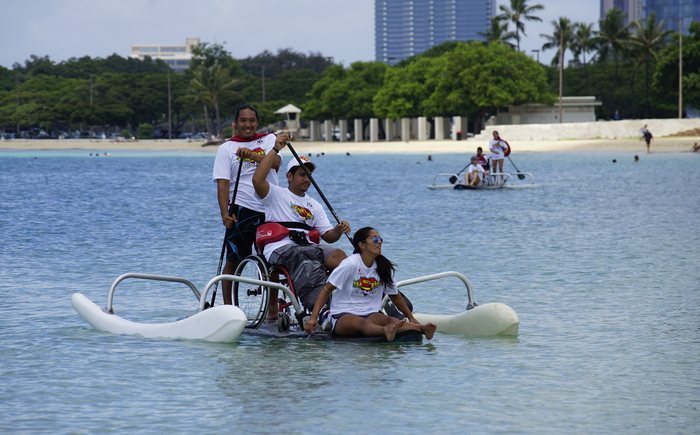 Volunteer for Adaptive Freedom Foundation and Just Like Me "Paddle Day at the Bay" Banner